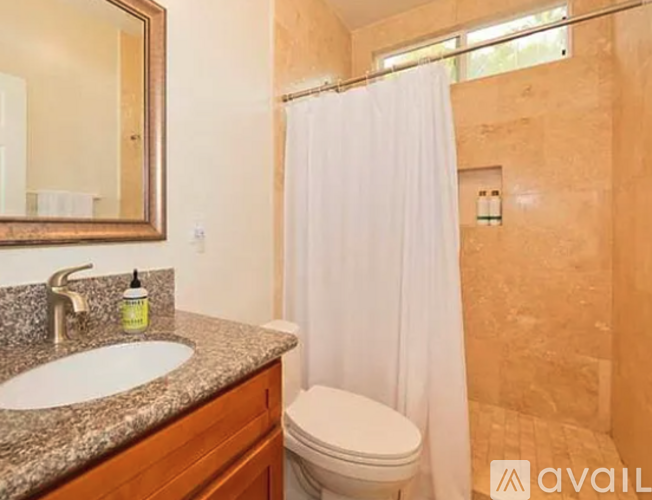 A bathroom with a sink, toilet, and shower.