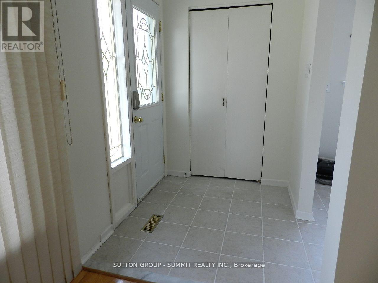 A room with a door, a window, and a wardrobe.