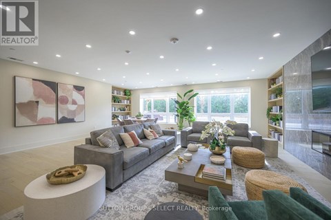 A modern living room with a grey sofa and a coffee table.