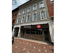 A building with a Revive Studios sign on the front.