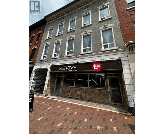 A building with a Revive Studios sign on the front.