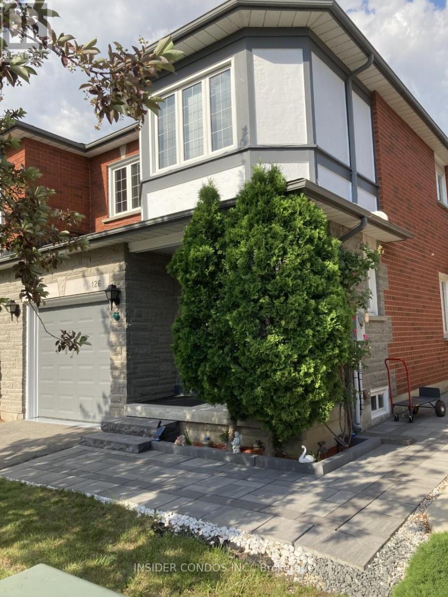 A house with a grey garage door and a grey window.
