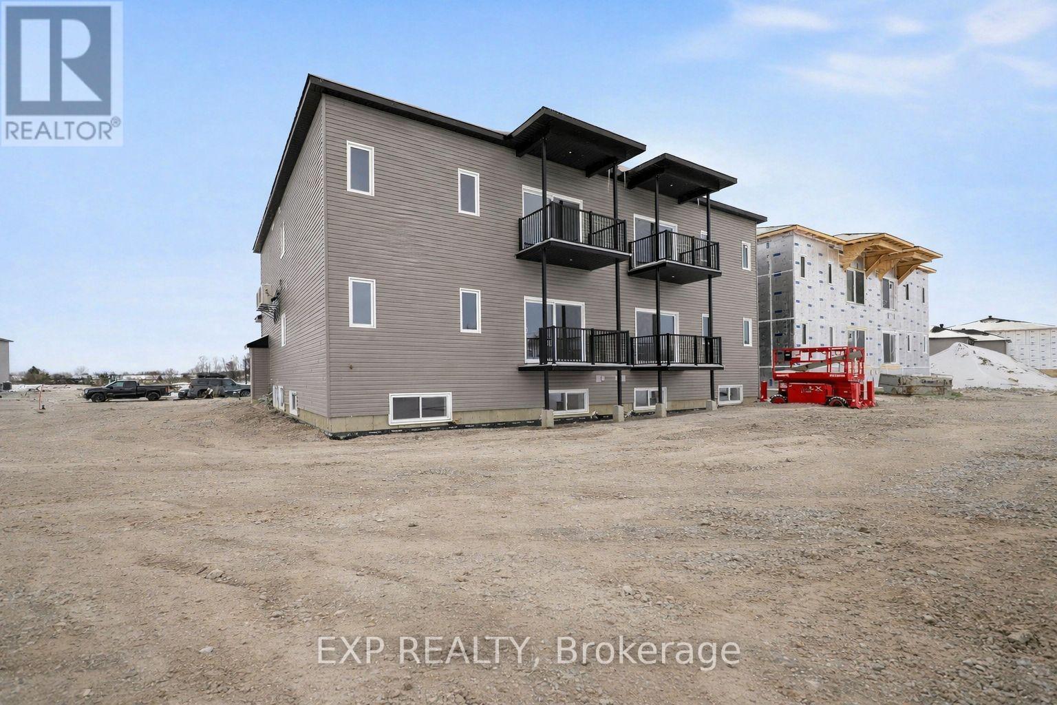 A building with the text EXP REALTY, Brokerage in front of it.