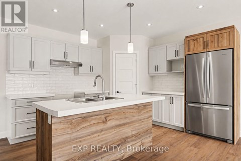 A kitchen with a white counter top and wooden cabinets.