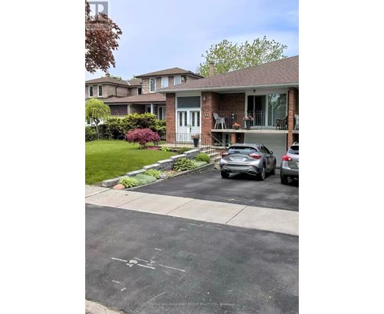 A house with a car parked in front of it.