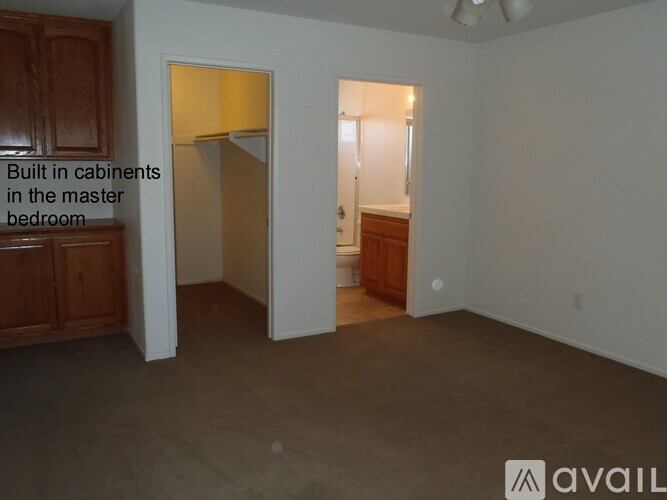 A room with built in cabinets in the master bedroom.