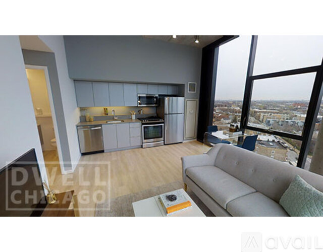 A modern kitchen with a view of the city.