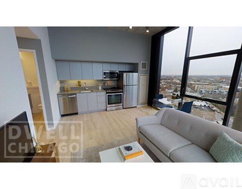 A modern kitchen with a view of the city.