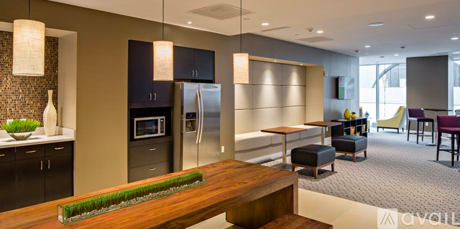 A kitchen with a wooden island in the middle.