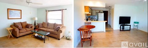 A living room with a brown couch and a dining area with a wooden table.