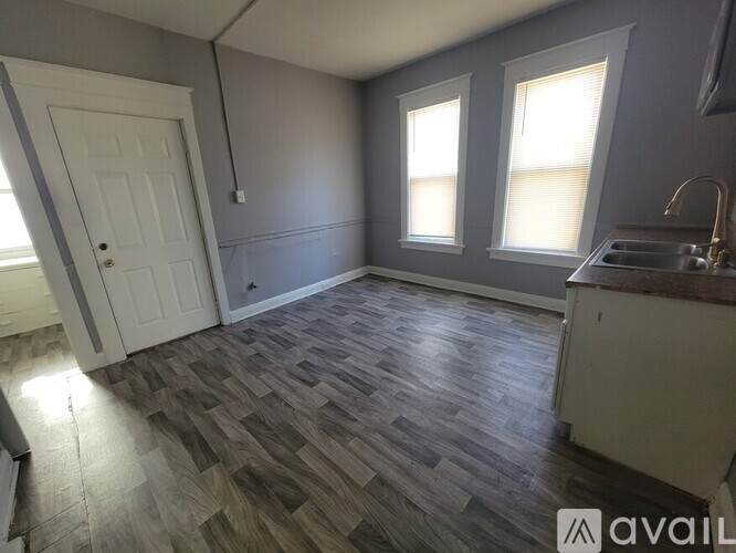 A kitchen with a sink and a window.