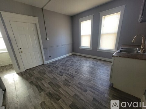 A kitchen with a sink and a window.