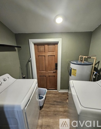 A laundry room with a washer and dryer.