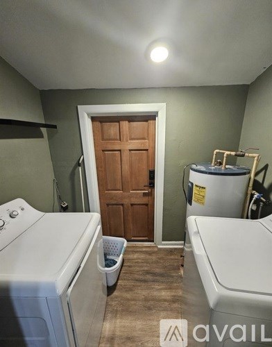 A laundry room with a washer and dryer.
