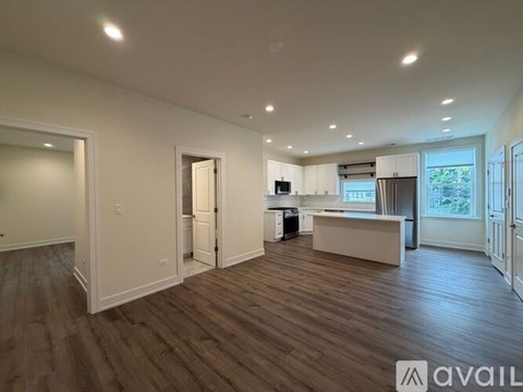 A kitchen with wooden cabinets and a brick wall.