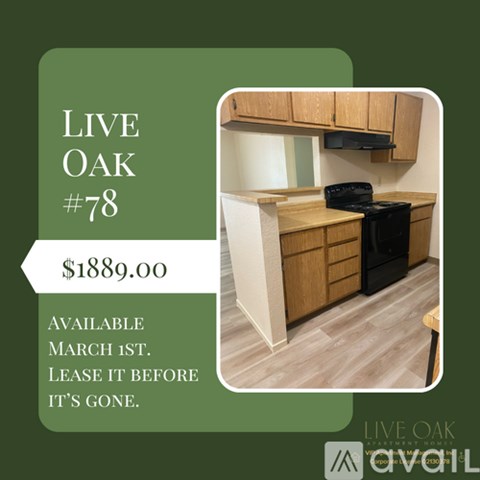 A kitchen with wooden cabinets and a black stove top oven is for rent at $1889.00.