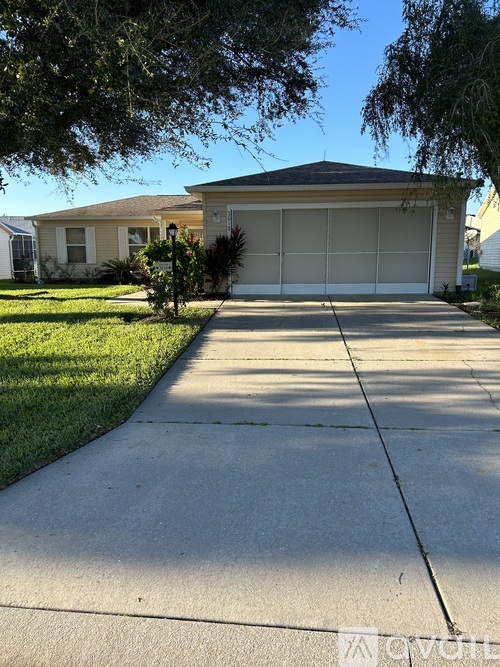 A house with a garage and a driveway.