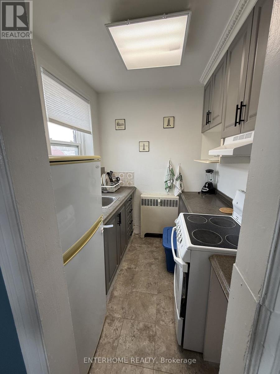 A small, clean kitchen with a washer and dryer.