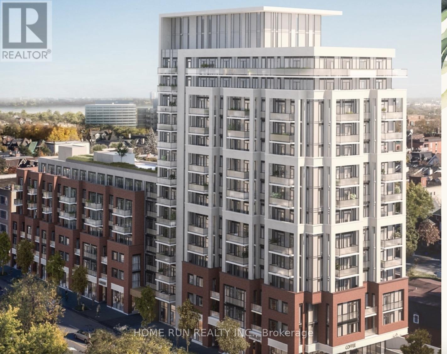 A tall building with a balcony on the top floor is shown in the image.