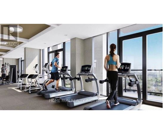 A gym with people exercising and a sign that says "REALTOR".