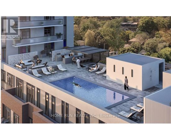 A modern building with a pool and a person standing by it.