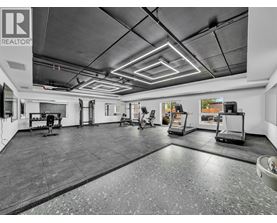 A spacious garage with a tiled floor and a high ceiling.