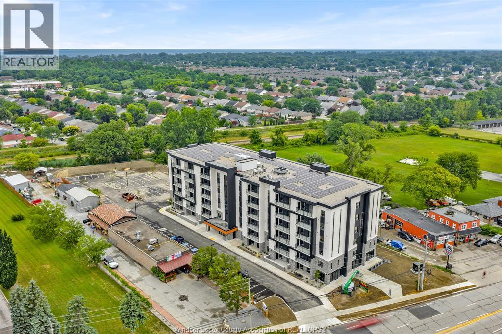 A realtor logo is visible on an aerial image of a residential area.