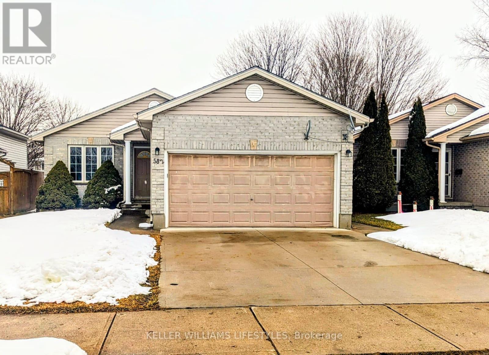 A house with a garage is for sale.