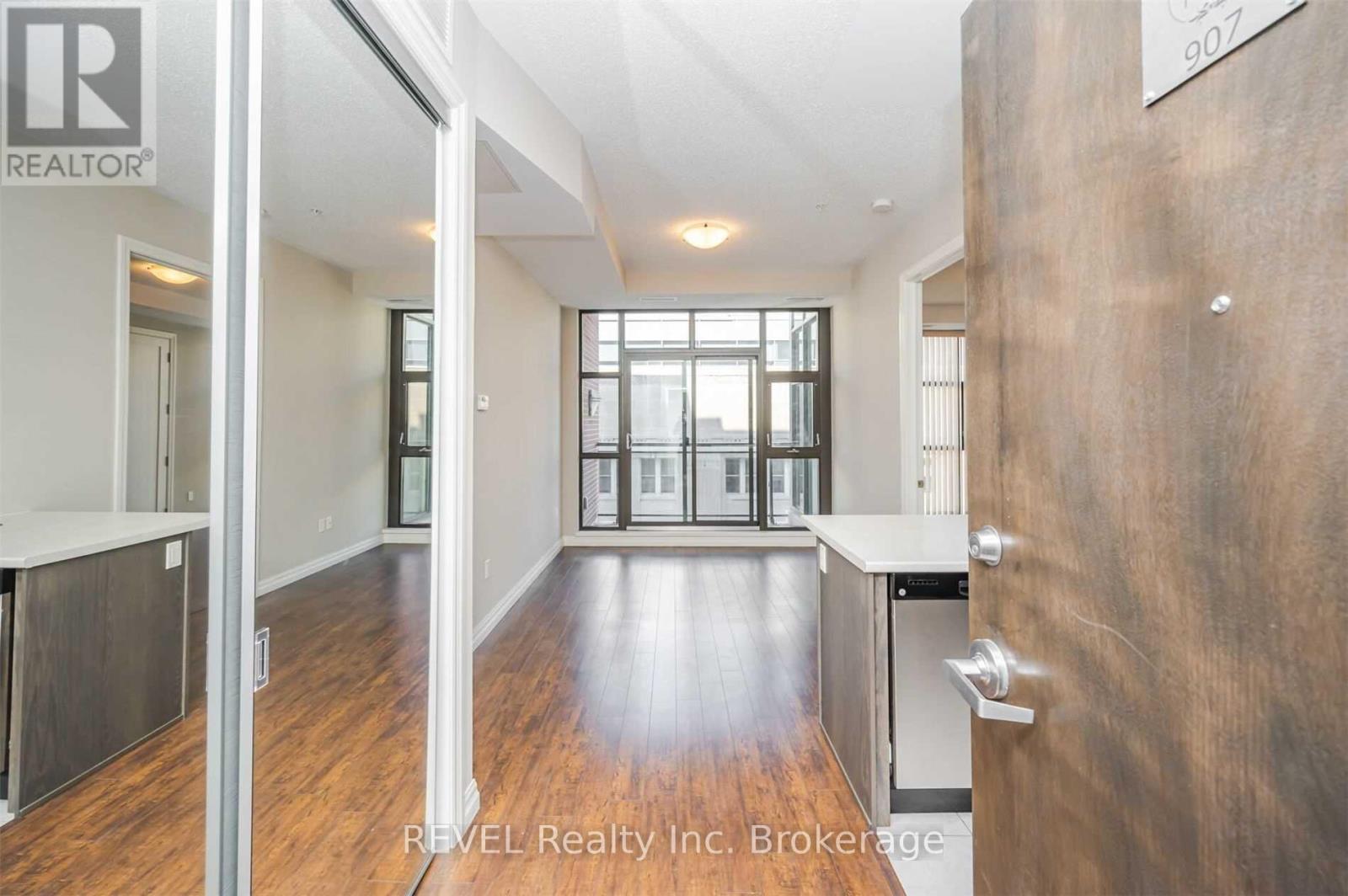 A brokerage office with a large open space and a view of the city.