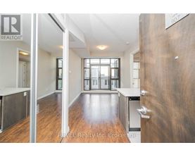 A brokerage office with a large open space and a view of the city.