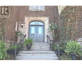 The front steps of a building with a sign that says "Save Max Bulls Realty Brokerage".