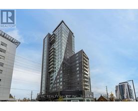 A tall building with many windows is the main focus of the image.