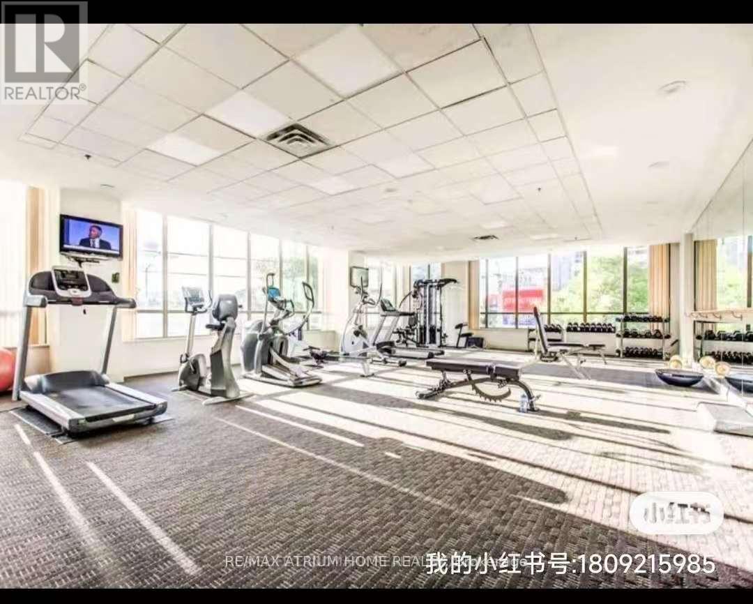 A well-equipped gym with treadmills, exercise bikes, and other fitness equipment.