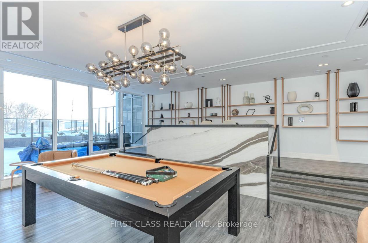 A pool table in a room with a REALTOR® logo.