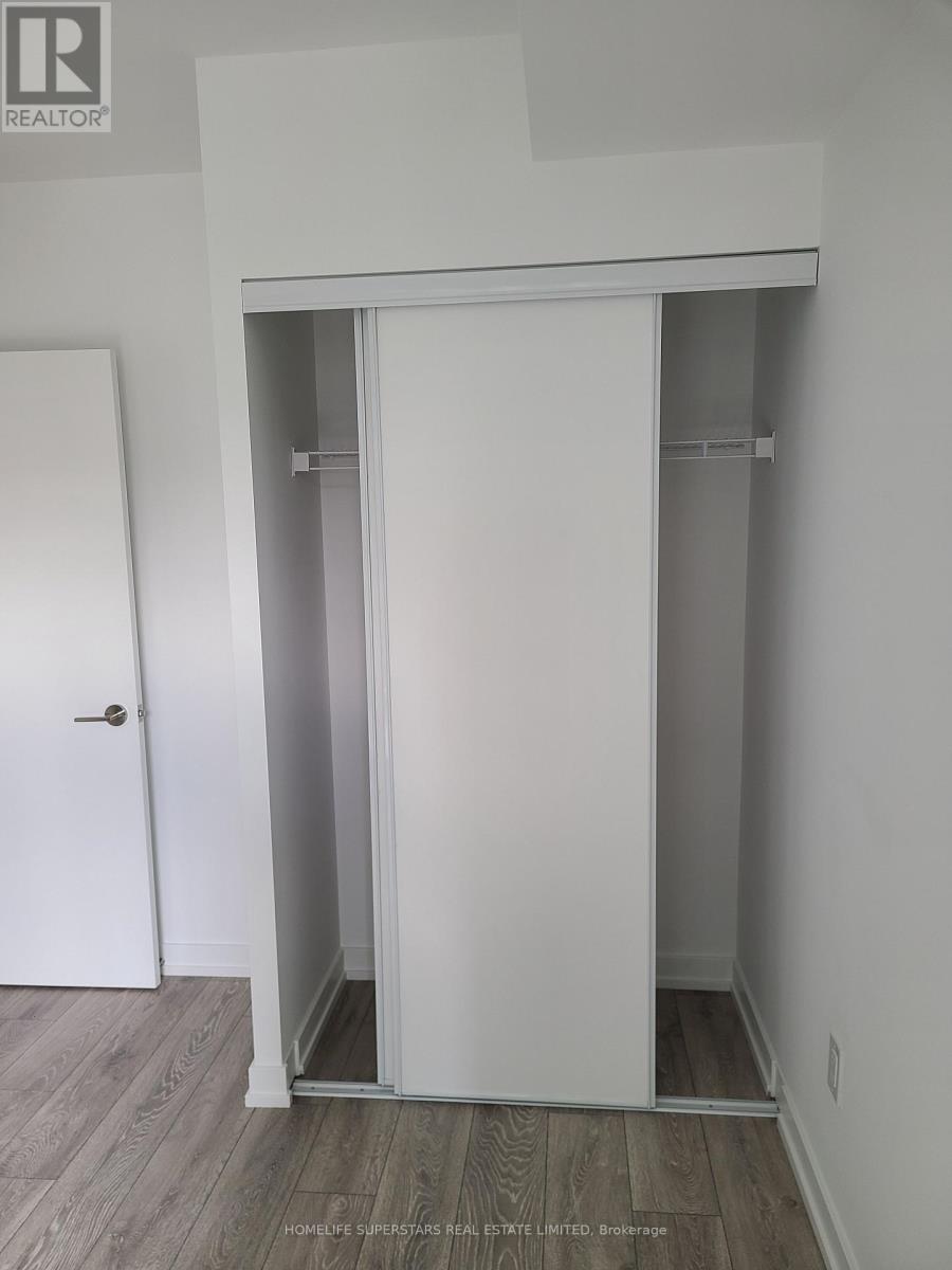 A white door is open to a small closet.