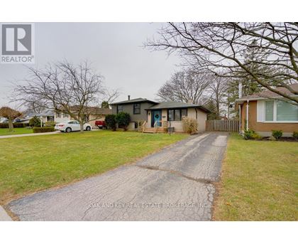 A real estate brokerage logo is displayed on a residential property listing.