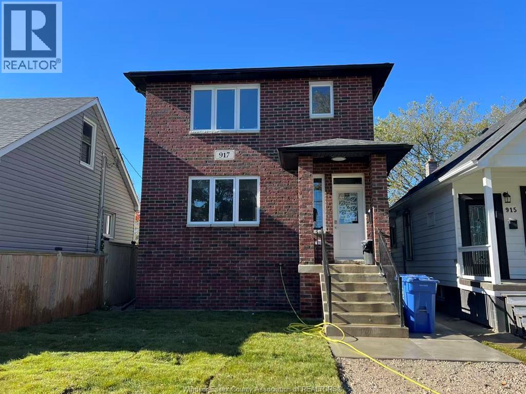 A house with the number 917 on it is for sale.