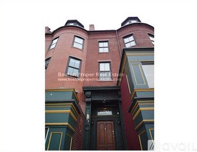 A building with a brown door and windows.