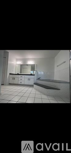 A bathroom with a sink and mirror.