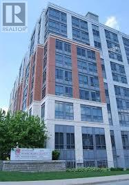 A tall building with a sign that says REALTOR in the top left corner.