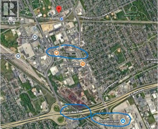 A map shows a section of a city with roads, buildings, and a location marked "Tim Hortons.".