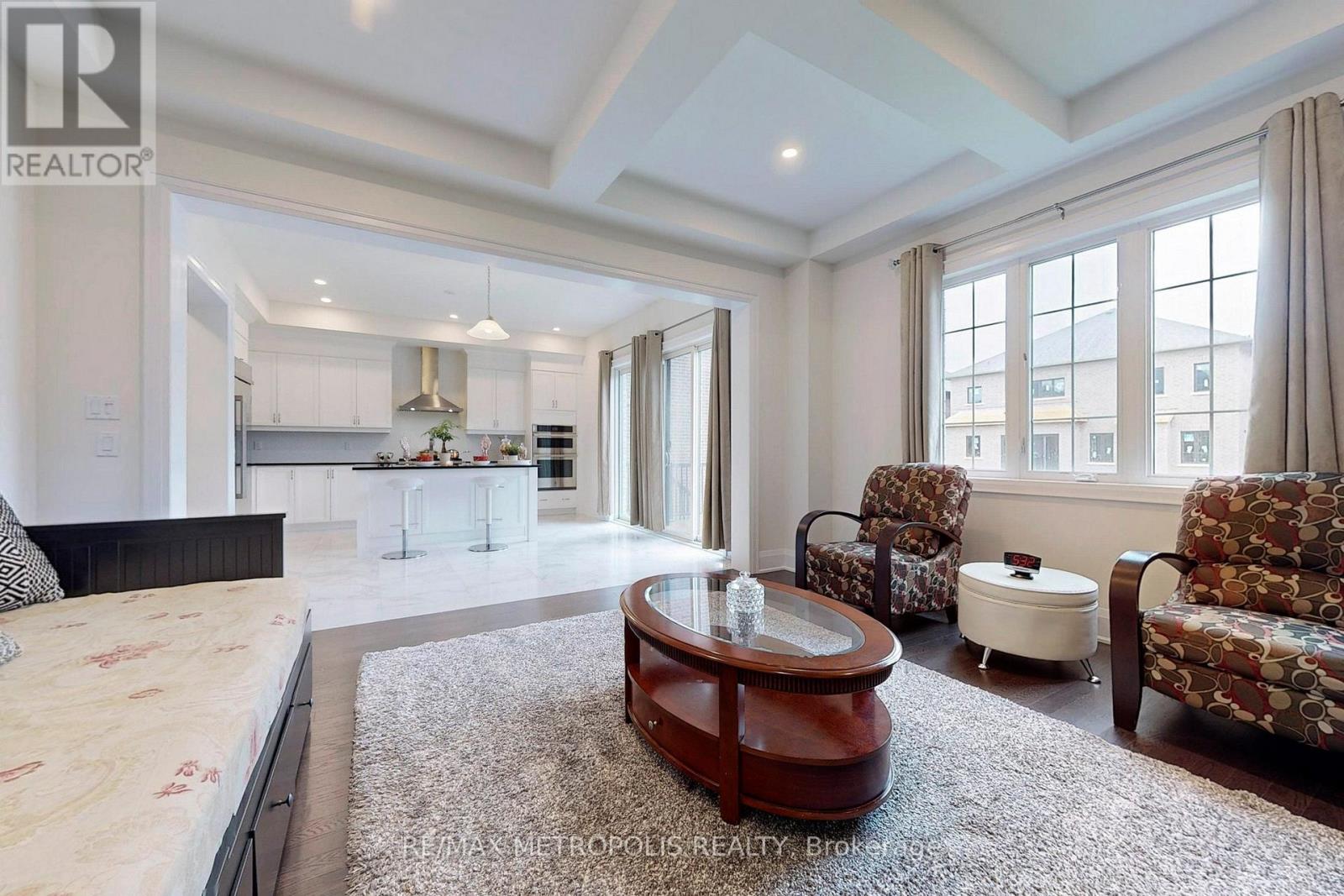 A spacious bedroom with a large bed and a coffee table.