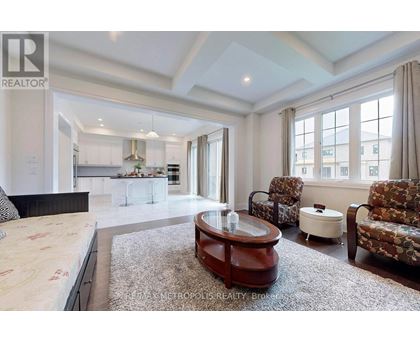 A spacious bedroom with a large bed and a coffee table.