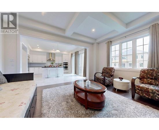 A spacious bedroom with a large bed and a coffee table.
