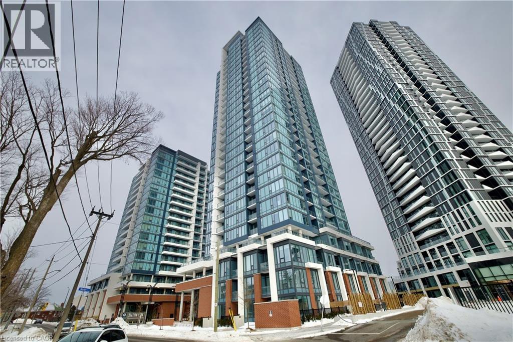 Three modern high-rise buildings are shown in the image.