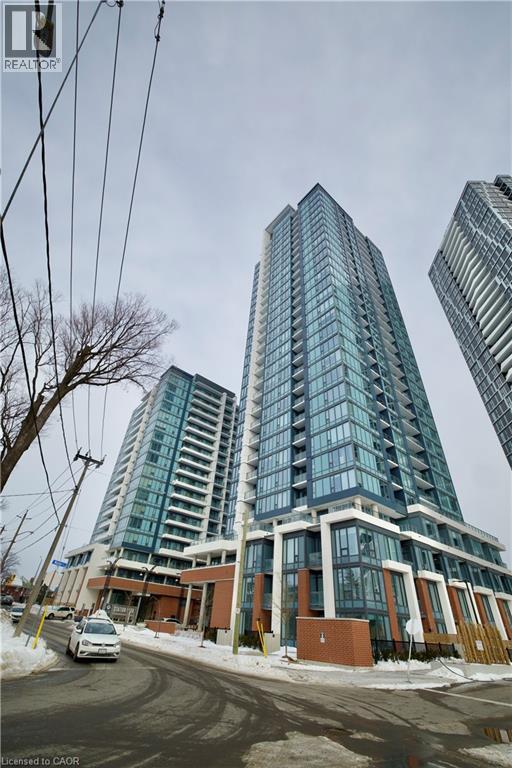 A tall building with many windows is in the foreground of the image.
