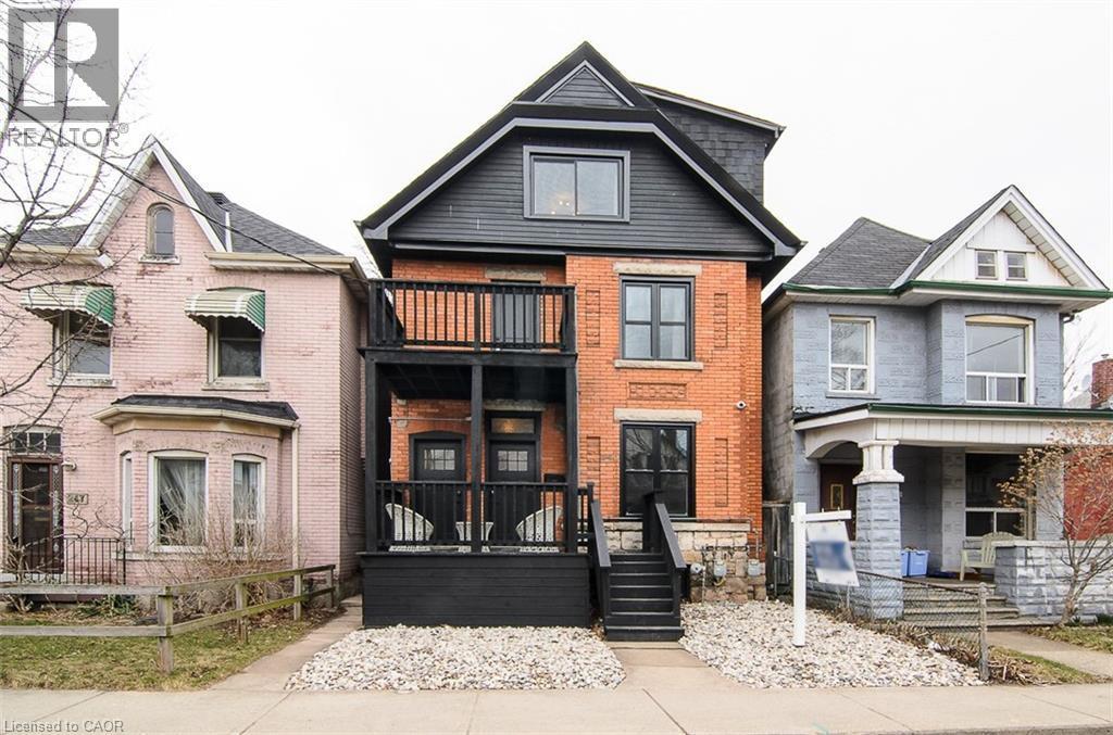 A house with a black front door and steps.