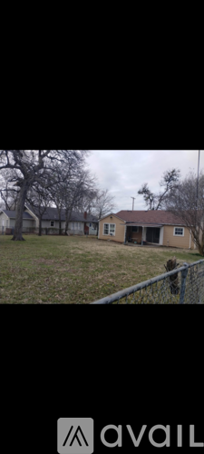 A house with a fence in front of it.