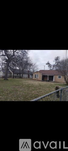 A house with a fence in front of it.