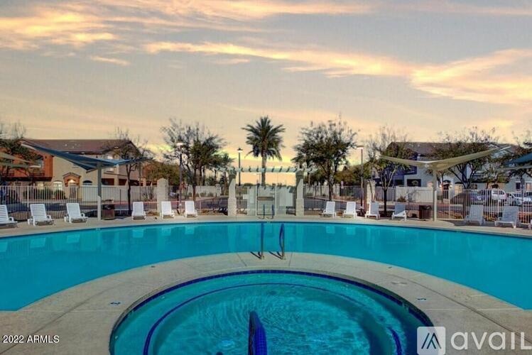 A pool with a slide in the middle of it.